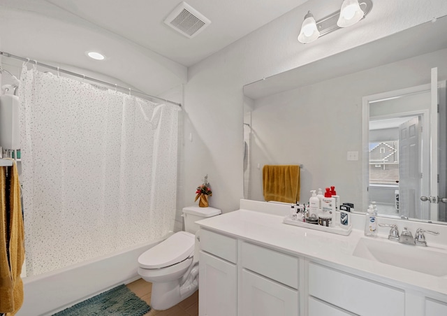 full bathroom featuring tile patterned flooring, vanity, toilet, and shower / bath combo