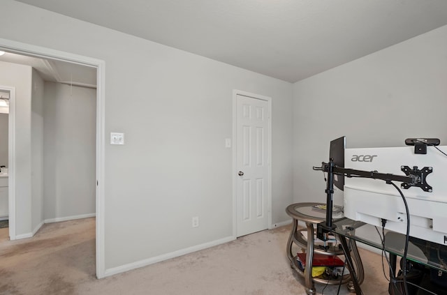 workout room featuring light carpet