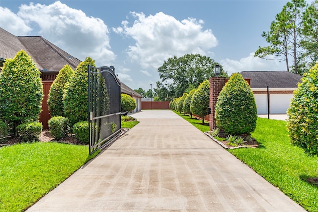 view of home's community with a yard