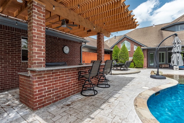 view of patio with a bar