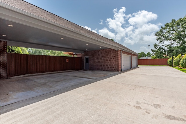 garage featuring a carport