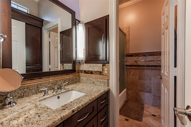 bathroom with vanity, tile walls, tile patterned floors, and tasteful backsplash