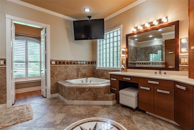 bathroom with crown molding, vanity, a wealth of natural light, and separate shower and tub