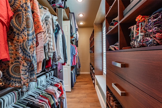 walk in closet featuring light hardwood / wood-style floors