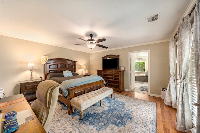 bedroom featuring visible vents, ornamental molding, ceiling fan, light wood-type flooring, and baseboards