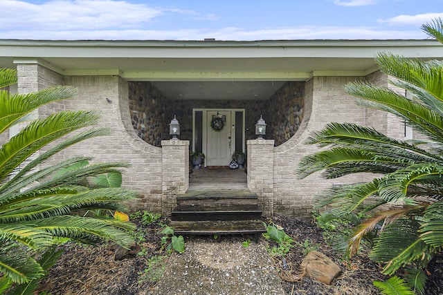 doorway to property with a porch