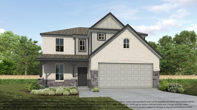 view of front of home with a front yard, a garage, and covered porch