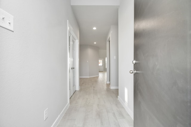 hallway with light wood-type flooring