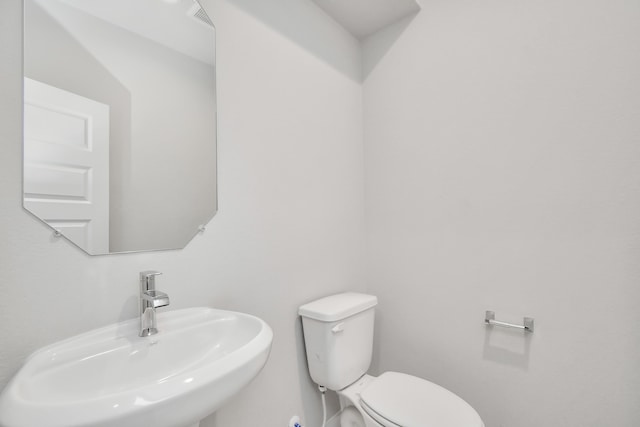 bathroom with sink and toilet