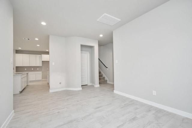 unfurnished living room featuring light hardwood / wood-style floors