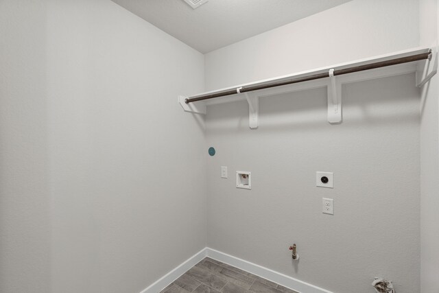 laundry area featuring gas dryer hookup, electric dryer hookup, and washer hookup