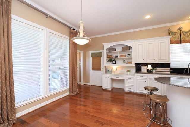 kitchen with crown molding, open shelves, a sink, and white cabinets