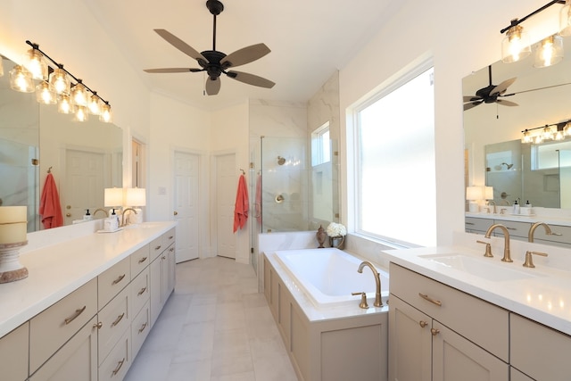 bathroom with a sink, a ceiling fan, and a shower stall
