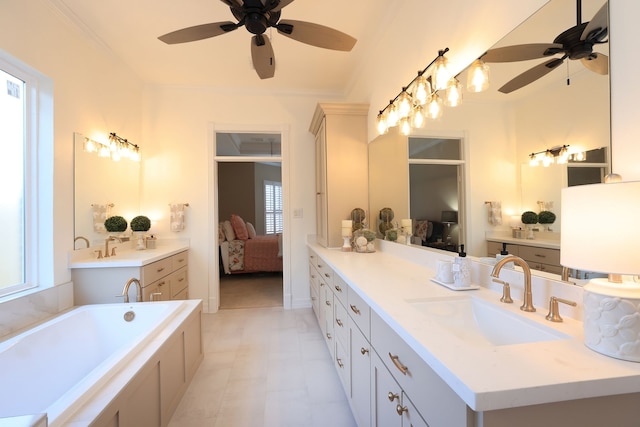 bathroom with vanity, a ceiling fan, a garden tub, and ensuite bath