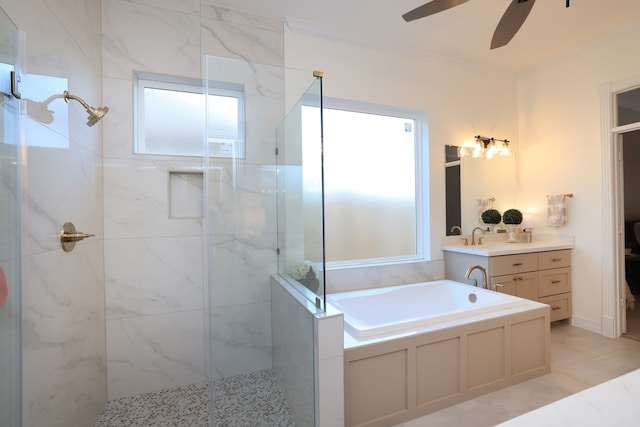 bathroom featuring vanity, a ceiling fan, a stall shower, and a bath