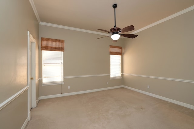 spare room with baseboards, a ceiling fan, light carpet, and ornamental molding