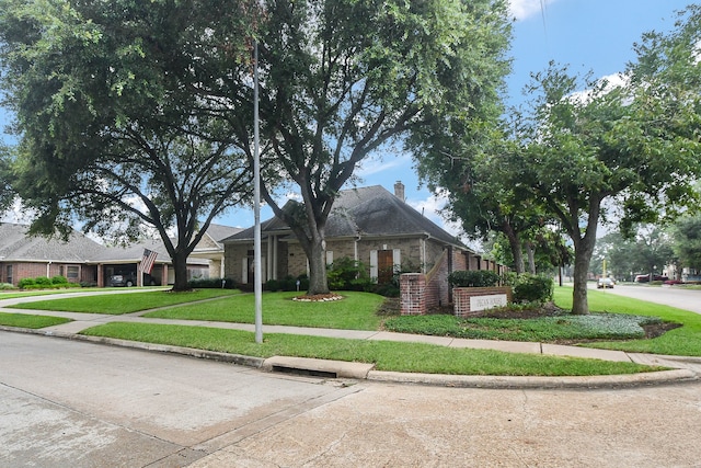 view of front of home with a front lawn