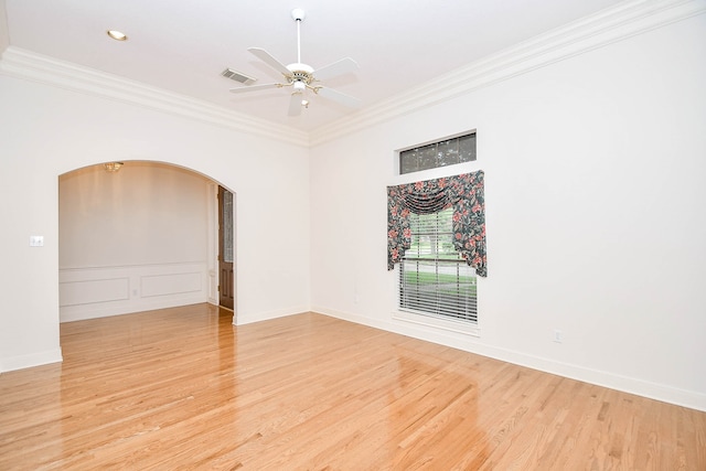 spare room with crown molding, ceiling fan, and light hardwood / wood-style floors