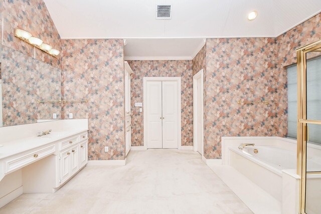 bathroom with ornamental molding, vanity, tile patterned flooring, and a washtub