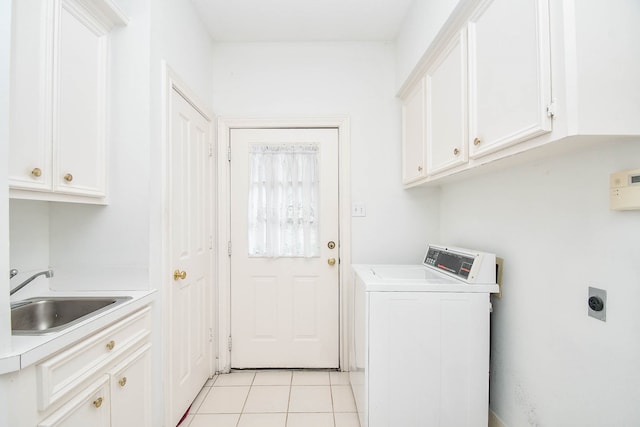 laundry area featuring washer / dryer, light tile patterned floors, cabinets, and sink