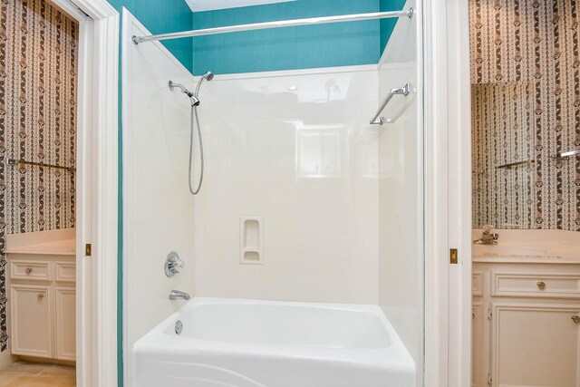 bathroom with shower / bathtub combination and vanity