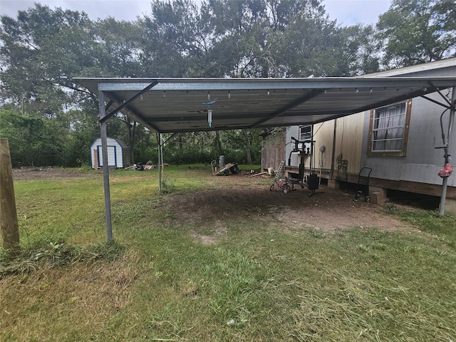 view of yard with a carport and a shed