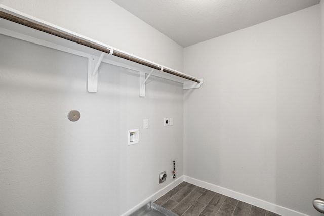 laundry area featuring dark hardwood / wood-style flooring, gas dryer hookup, hookup for a washing machine, and electric dryer hookup