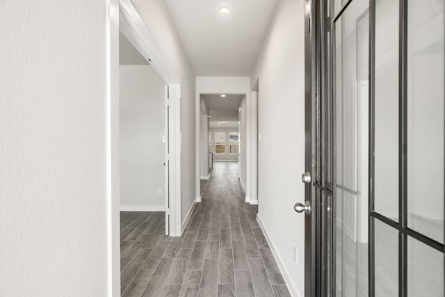 hall with dark wood-type flooring