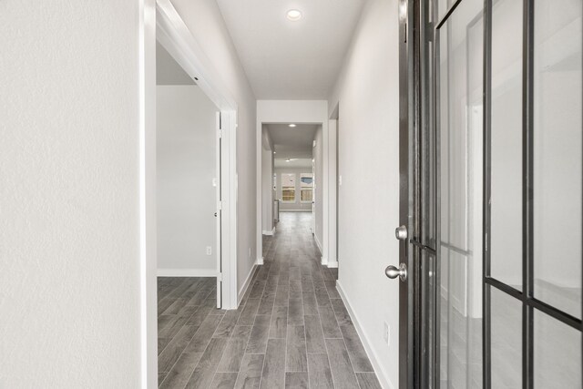 8427 Northern Pintail Dr, Houston, TX 77049 - hall featuring baseboards and wood finished floors