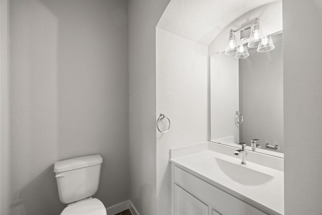 8427 Northern Pintail Dr, Houston, TX 77049 - half bathroom with baseboards, toilet, and vanity