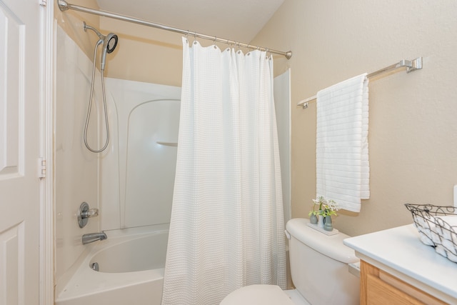 full bathroom featuring vanity, shower / tub combo, and toilet