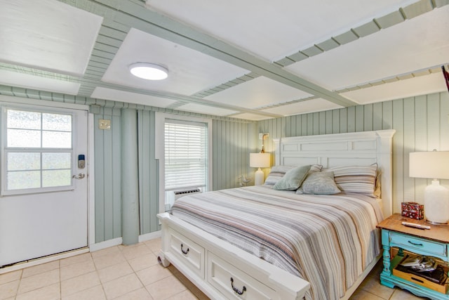 tiled bedroom featuring coffered ceiling