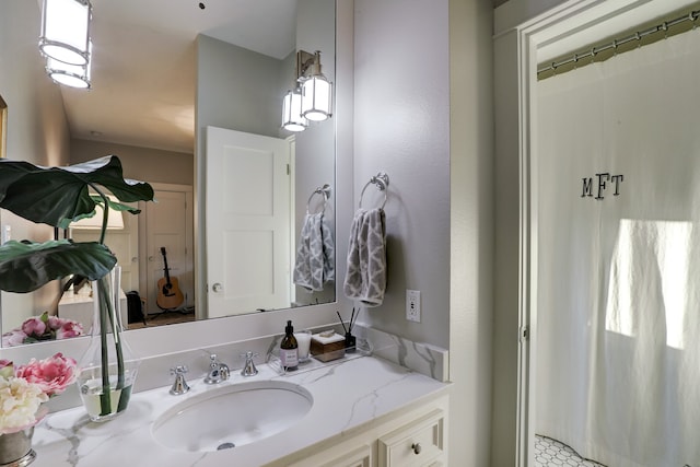 bathroom with curtained shower and vanity