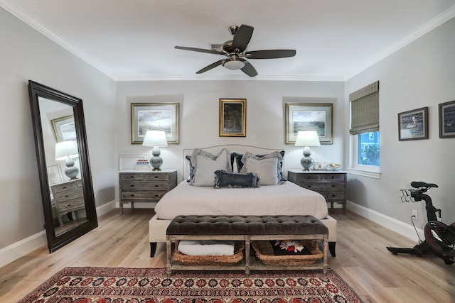 bedroom featuring ceiling fan, light wood-type flooring, and ornamental molding