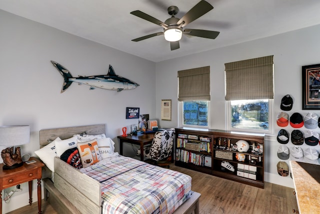 bedroom with hardwood / wood-style floors and ceiling fan