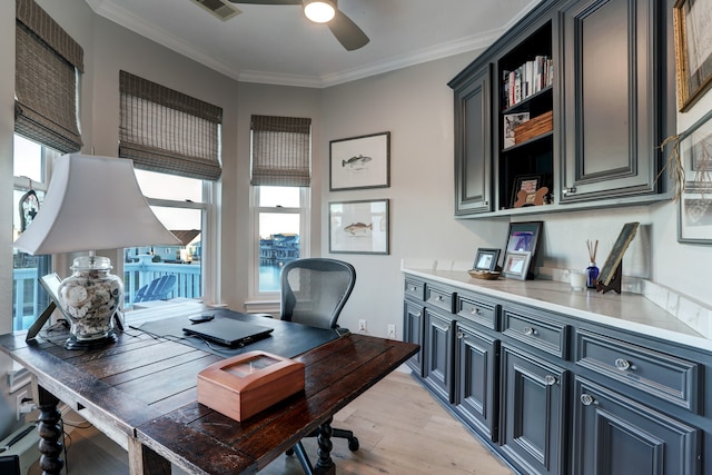 office area featuring light hardwood / wood-style floors, ceiling fan, and crown molding