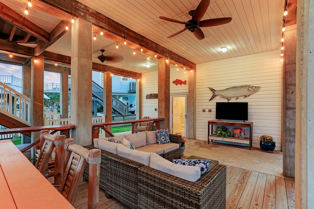 living room featuring wood ceiling, ceiling fan, wood-type flooring, and wood walls