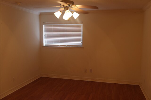 empty room with crown molding, ceiling fan, and dark hardwood / wood-style flooring