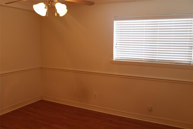 spare room with ceiling fan and dark hardwood / wood-style flooring