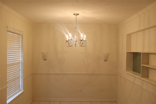 unfurnished dining area featuring ornamental molding, light tile patterned floors, and a notable chandelier