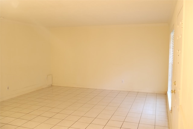 empty room with light tile patterned floors