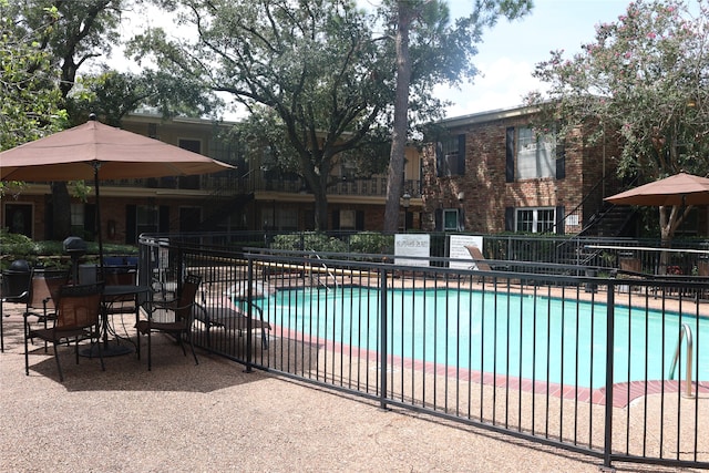 view of pool featuring a patio area