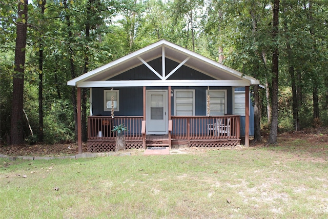 view of front of house featuring a front yard and a porch