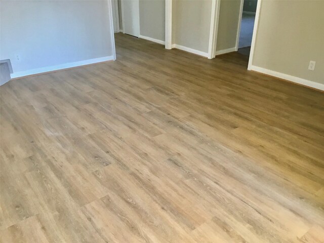 unfurnished room featuring light hardwood / wood-style floors