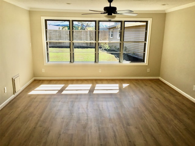 empty room with ceiling fan, ornamental molding, and hardwood / wood-style floors