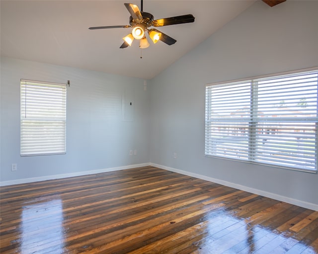 unfurnished room featuring ceiling fan, a wealth of natural light, and dark hardwood / wood-style floors