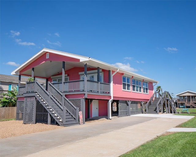 view of front of home featuring covered porch and a carport