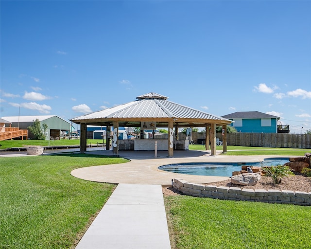 surrounding community with a swimming pool, a lawn, a patio, and a gazebo