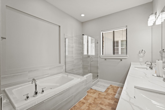 bathroom with vanity and separate shower and tub