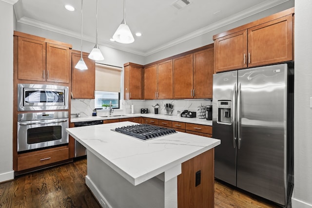 kitchen with dark wood-type flooring, a center island, stainless steel appliances, and hanging light fixtures